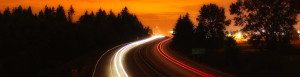 Glowing highway at night representing speed